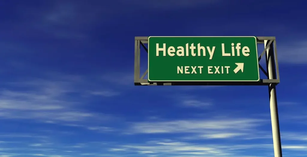 Road sign indicating that a healthy life is coming up at the next exit.